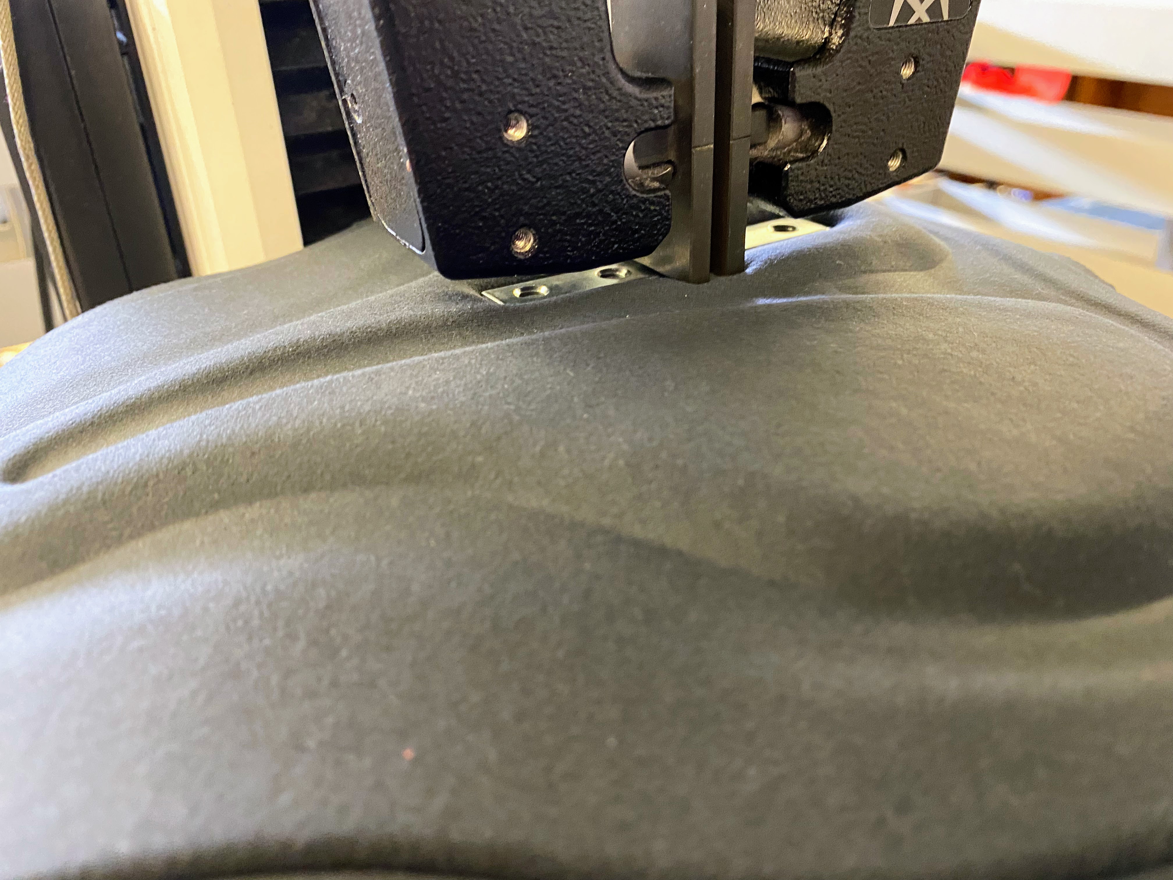 Custom rig compressing a foam sample to measure support